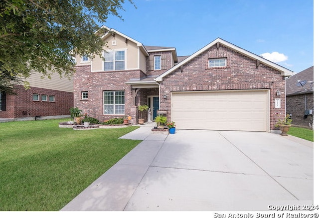 view of front of house featuring a garage and a front lawn