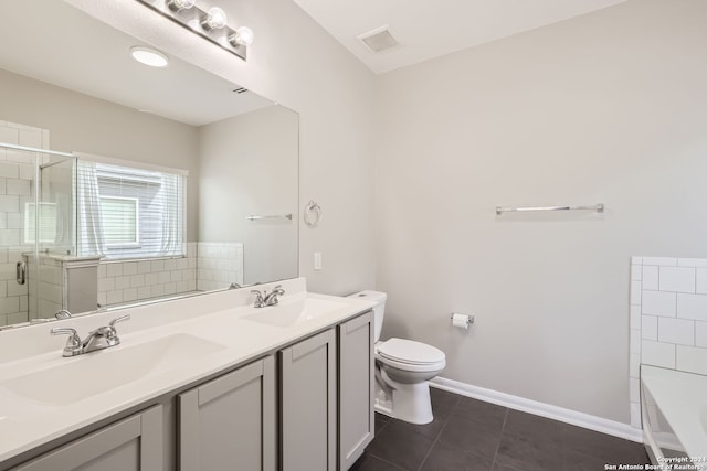 bathroom featuring vanity, tile patterned flooring, a shower with shower door, and toilet