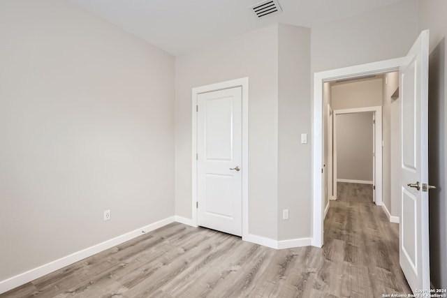 unfurnished bedroom featuring light hardwood / wood-style floors