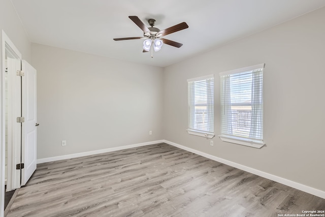 unfurnished bedroom with ceiling fan and light hardwood / wood-style flooring