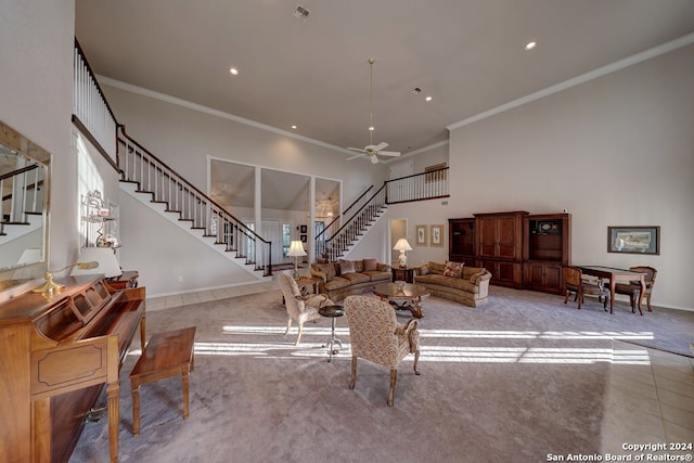 carpeted living room featuring ceiling fan and ornamental molding