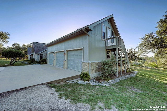 view of side of home featuring a lawn