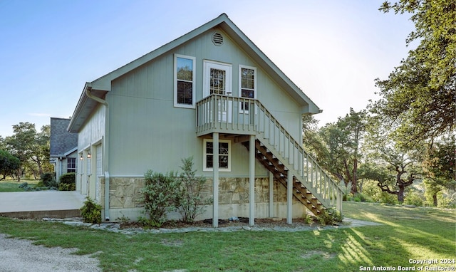 rear view of house with a yard