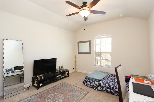 carpeted bedroom featuring lofted ceiling and ceiling fan