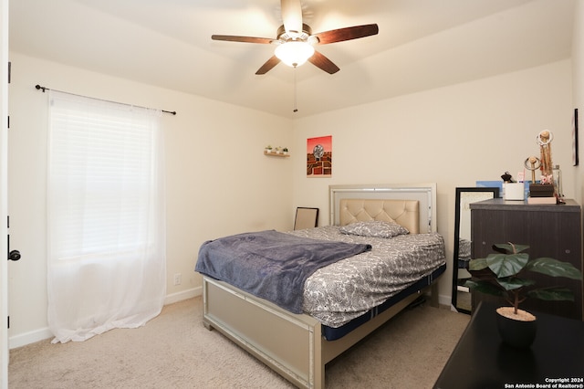 bedroom featuring ceiling fan and light colored carpet