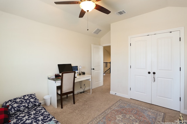 home office with light carpet, vaulted ceiling, and ceiling fan