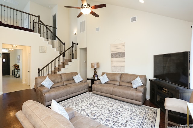 living room with ceiling fan, high vaulted ceiling, and hardwood / wood-style flooring