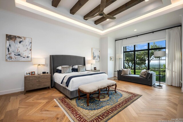 bedroom with light parquet flooring, a raised ceiling, access to exterior, and ceiling fan