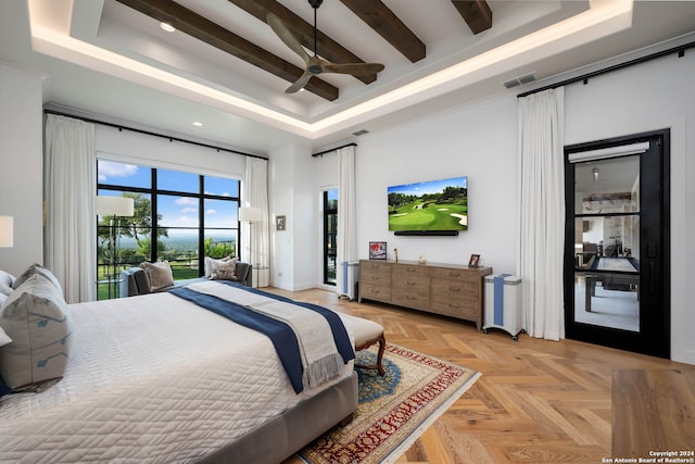 bedroom with access to exterior, ceiling fan, a raised ceiling, and light parquet flooring