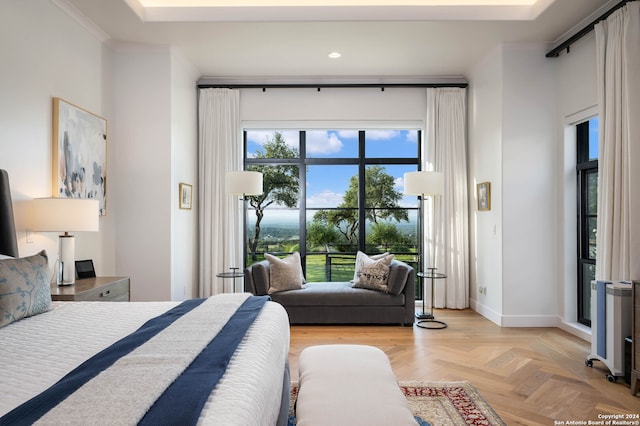 bedroom with light parquet floors and ornamental molding