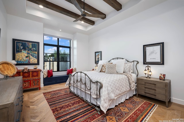 bedroom featuring light parquet floors, beamed ceiling, and ceiling fan