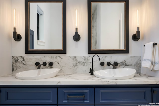 bathroom featuring decorative backsplash and vanity