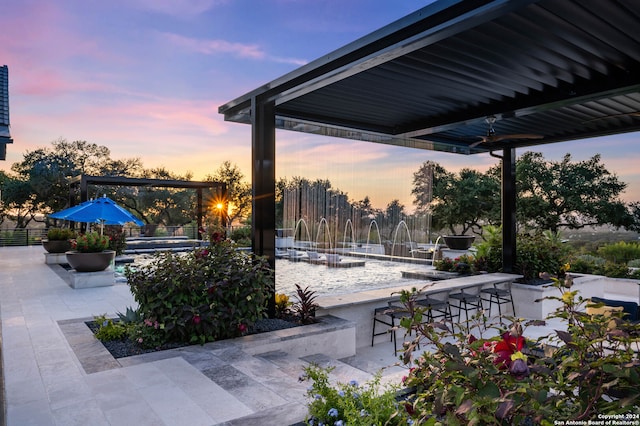 view of patio terrace at dusk