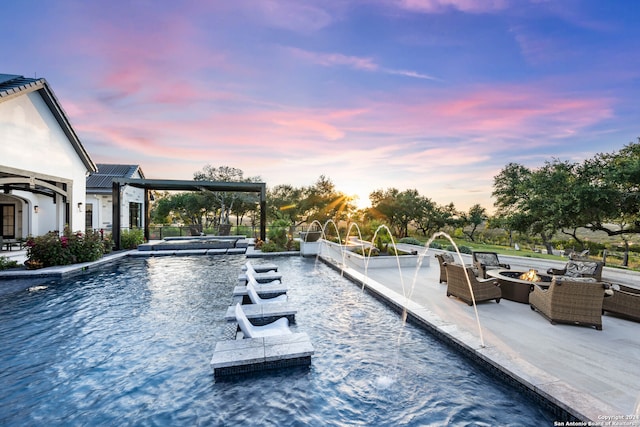 pool at dusk featuring outdoor lounge area and pool water feature