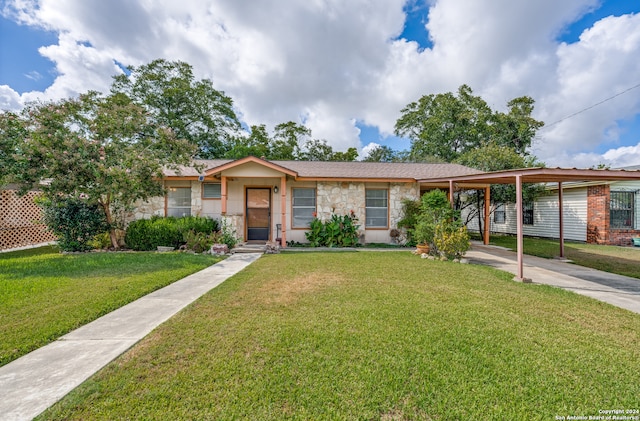 single story home featuring a front yard and a carport