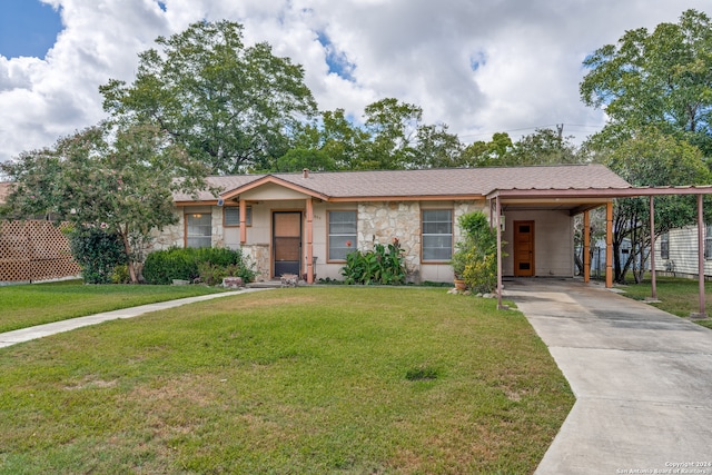 ranch-style home with a carport and a front yard