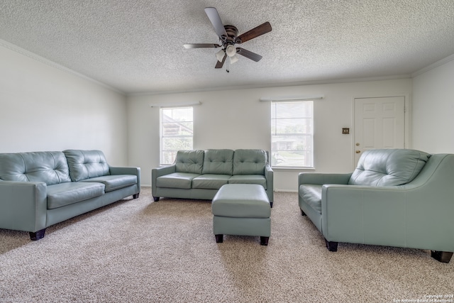 living room with a textured ceiling, light colored carpet, ceiling fan, and ornamental molding