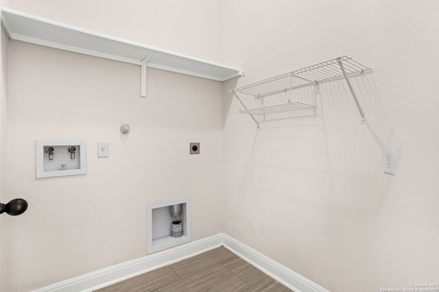 laundry room with washer hookup, electric dryer hookup, hookup for a gas dryer, and hardwood / wood-style flooring