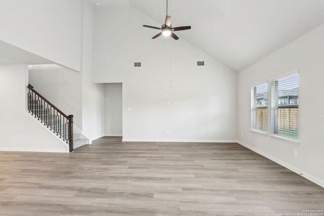 bedroom featuring carpet, ceiling fan, vaulted ceiling, and a tray ceiling