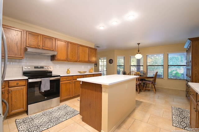 kitchen featuring a center island, plenty of natural light, stainless steel electric range, and decorative light fixtures