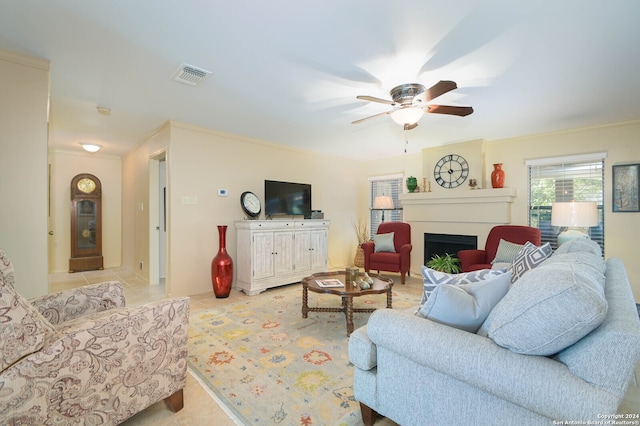 tiled living room with ceiling fan