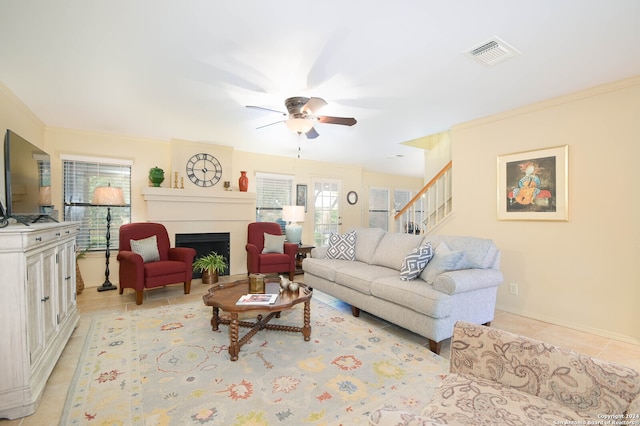 tiled living room featuring ceiling fan