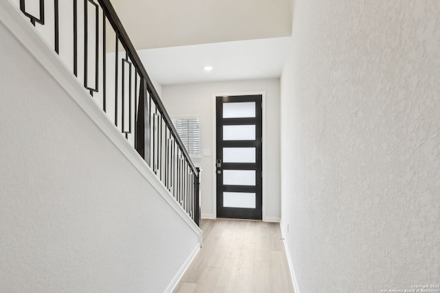 entrance foyer with light wood-type flooring