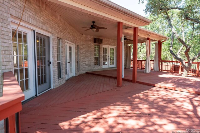 deck with french doors and ceiling fan