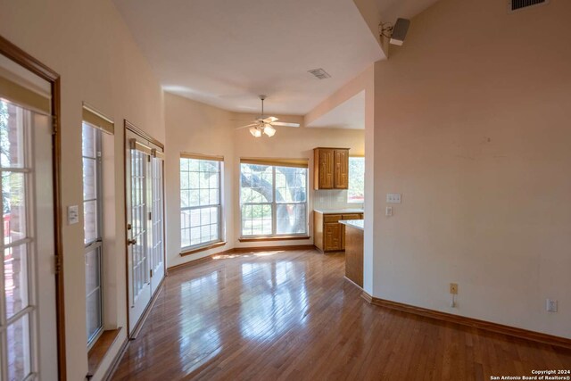 interior space featuring wood-type flooring and ceiling fan