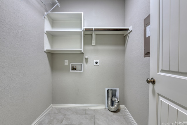 laundry room with hookup for a washing machine, light tile patterned floors, electric dryer hookup, and gas dryer hookup