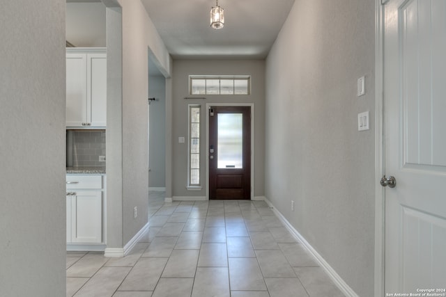 foyer entrance featuring light tile patterned floors