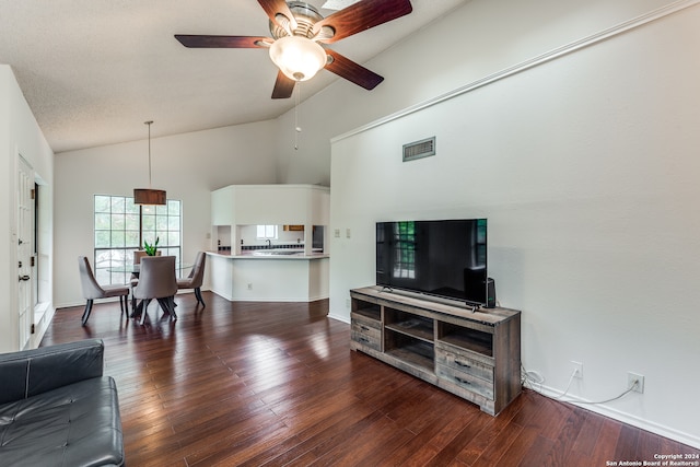 living room featuring high vaulted ceiling, ceiling fan, and dark hardwood / wood-style floors