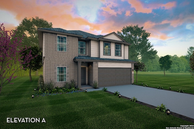 view of front of home featuring a yard and a garage