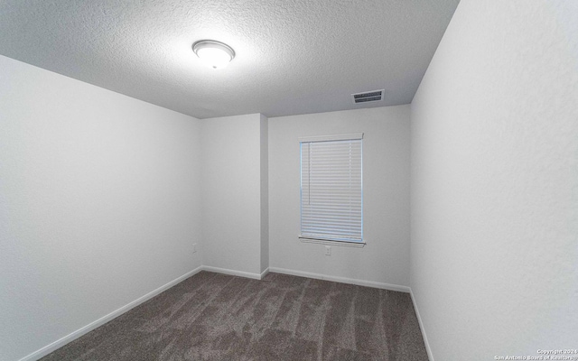 413 Tims Way, Seguin, TX 78155 - carpeted spare room with a textured ceiling and baseboards
