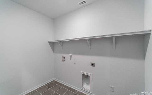 413 Tims Way, Seguin, TX 78155 - laundry area featuring hookup for an electric dryer, gas dryer hookup, baseboards, washer hookup, and dark tile patterned floors