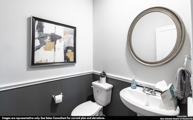 bathroom with toilet and sink