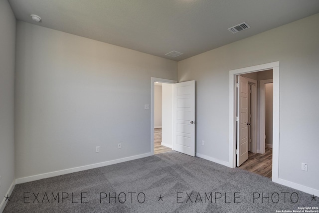 unfurnished bedroom with carpet