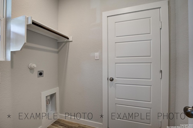 laundry room featuring hardwood / wood-style flooring and electric dryer hookup