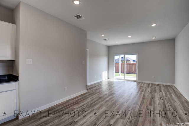 unfurnished room with light hardwood / wood-style flooring