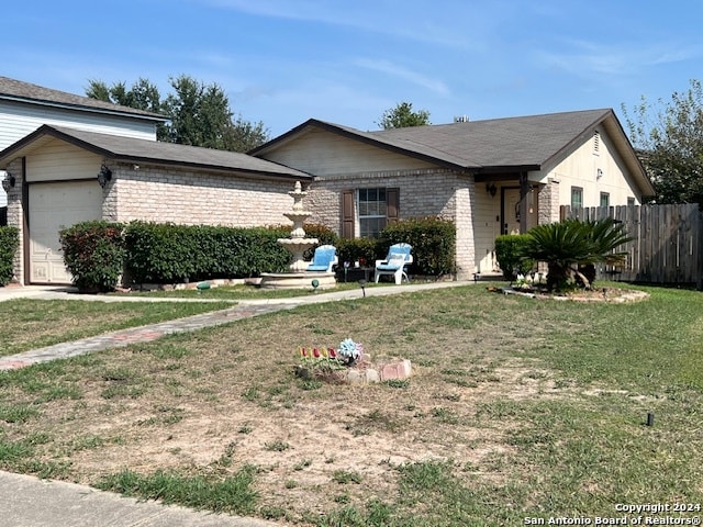 single story home with a garage and a front yard