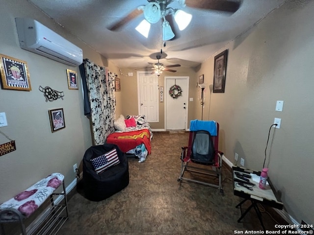 interior space with a wall mounted air conditioner and ceiling fan