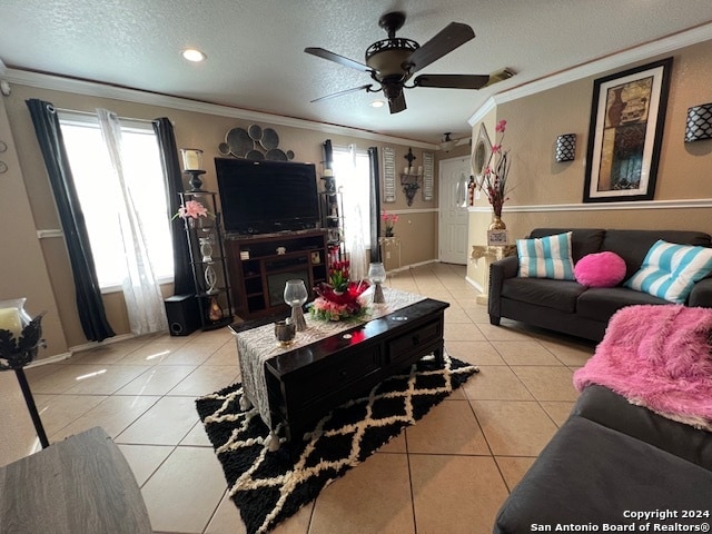 tiled living room with a textured ceiling, crown molding, and ceiling fan