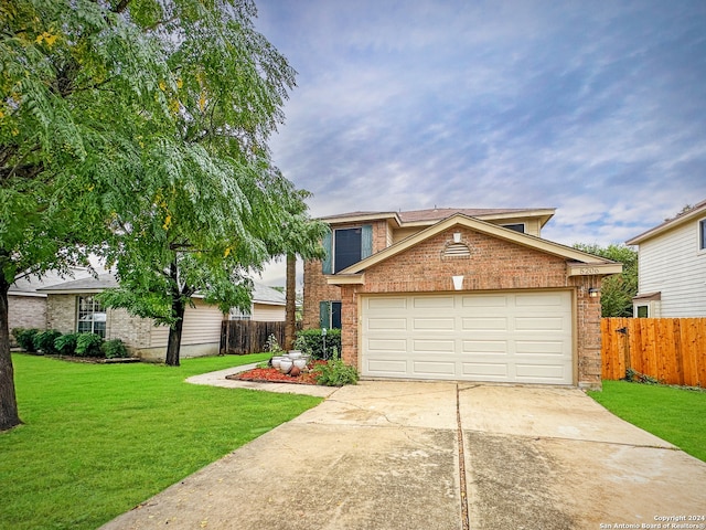 view of front of property with a front lawn and a garage