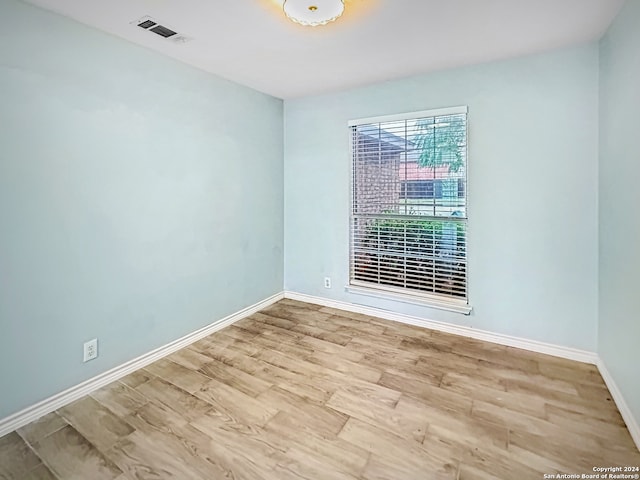 spare room featuring light hardwood / wood-style floors