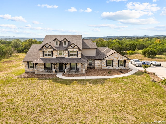 view of front of property with a front lawn and covered porch