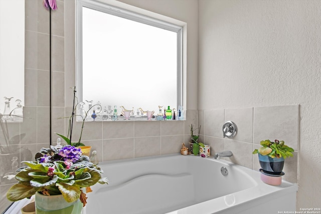 bathroom with a tub to relax in