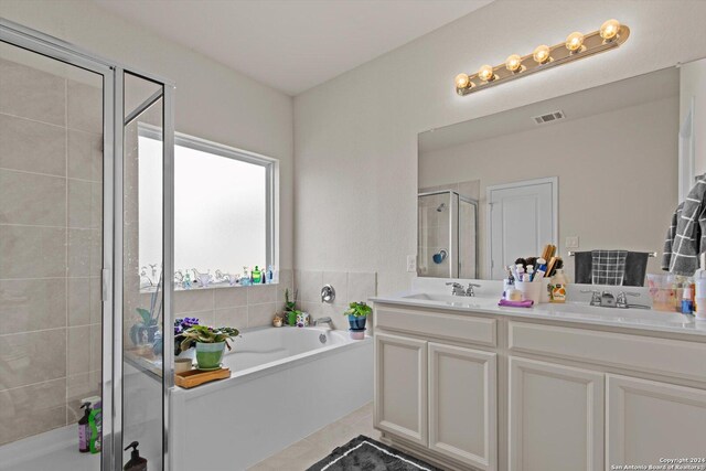 bathroom with vanity, toilet, and tile patterned floors