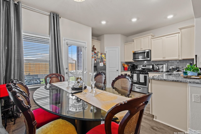 dining room with light hardwood / wood-style floors