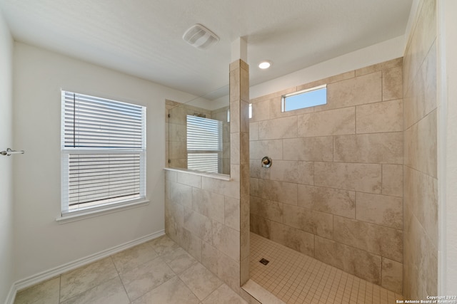 bathroom featuring a tile shower