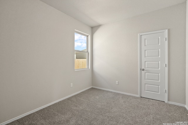 empty room featuring carpet flooring